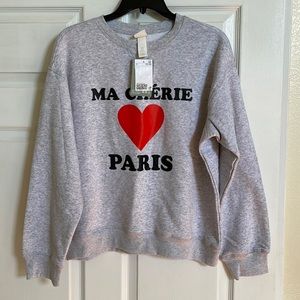 Light gray sweater. It’s a small but runs a little big.